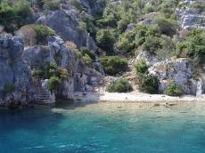 j_d blue water ocean sea mountains rocks trees bay stairs beach white sand