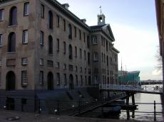 town stone building maritine museum amsterdam bridge