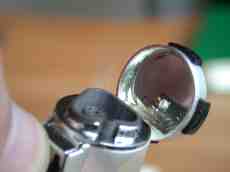 lighter metal shiny rounded mirror