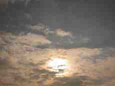 evening sky sun behind clouds eva