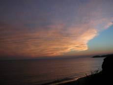 sunset evening sky clouds orange water coast