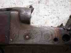 gun closeup metal trigger wood brown