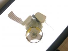 pricegun price gun tag tagging bright lights light round tool shopping