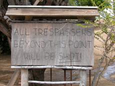 objects sign signs handwriting wood wooden tresspassers will be shot border