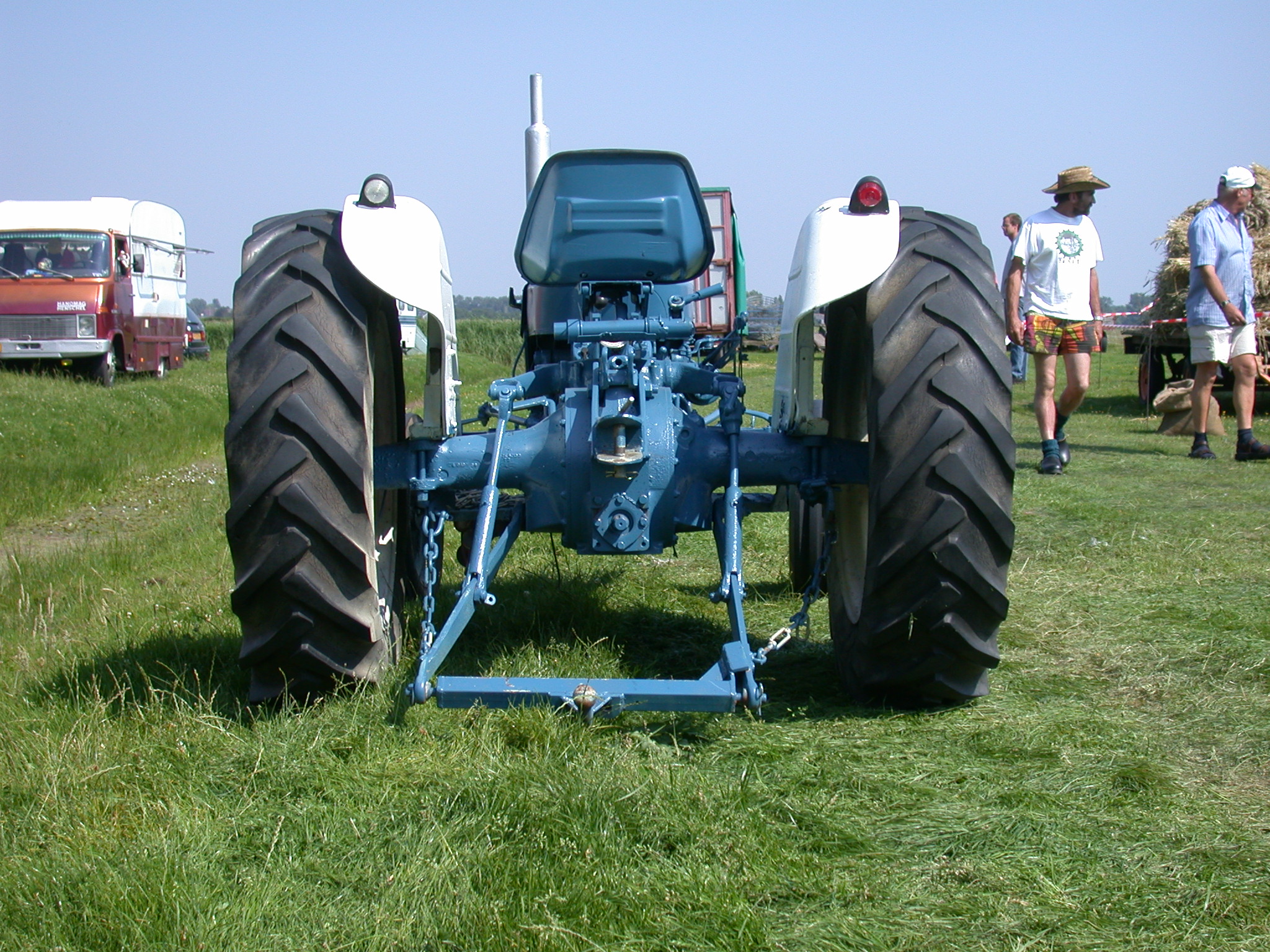 Image*After images tractor blue farm equipment huge large big wheel