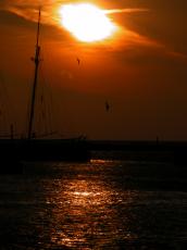 vehicles water boat sailboat sunset sunrise dusk dawn silhouette water sea