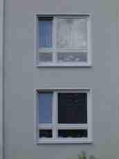 rigoletto wall building window windows house gray