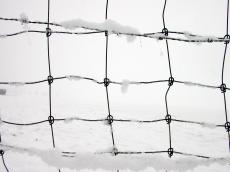 net fence wires knots snow field cold blanket