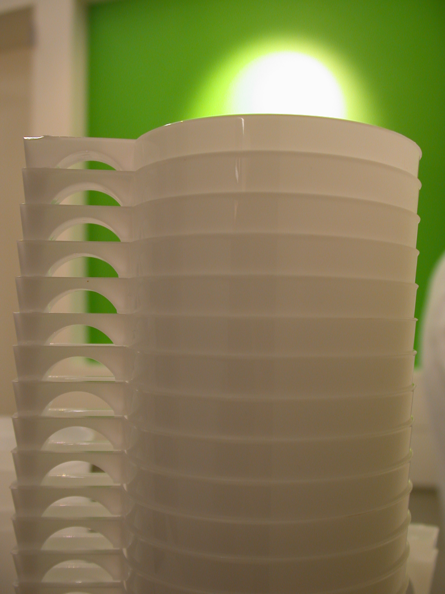 plastic cup cups stack stacked drinking recepticle white green light