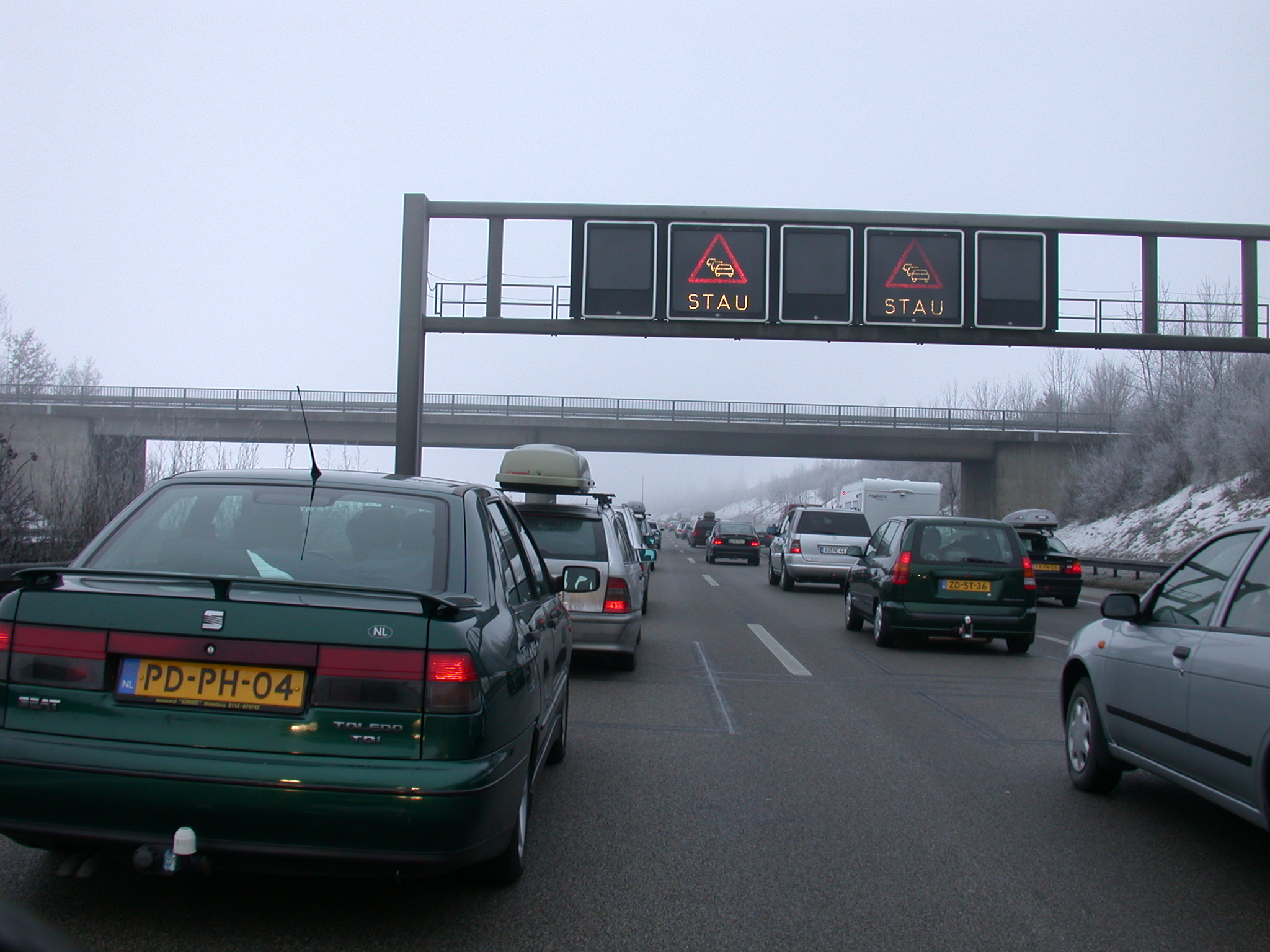 vehicles land trafficjam jam traffic car cars road roadsigns signs stay bridge light typography sanserif objects