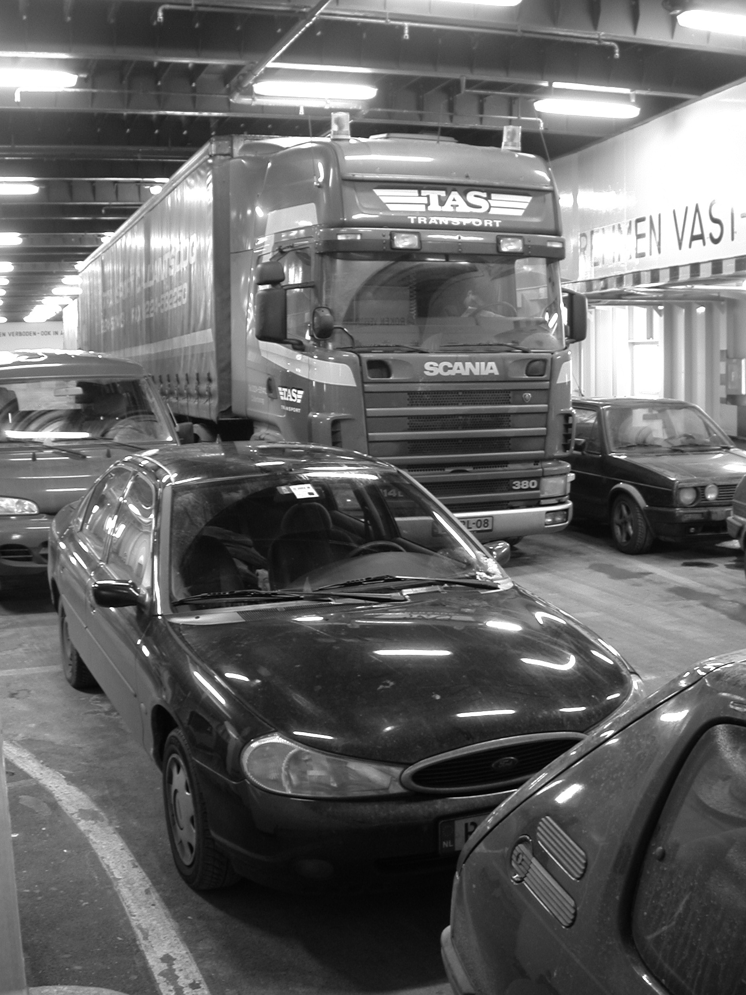cars on ferry black white reflection lights
