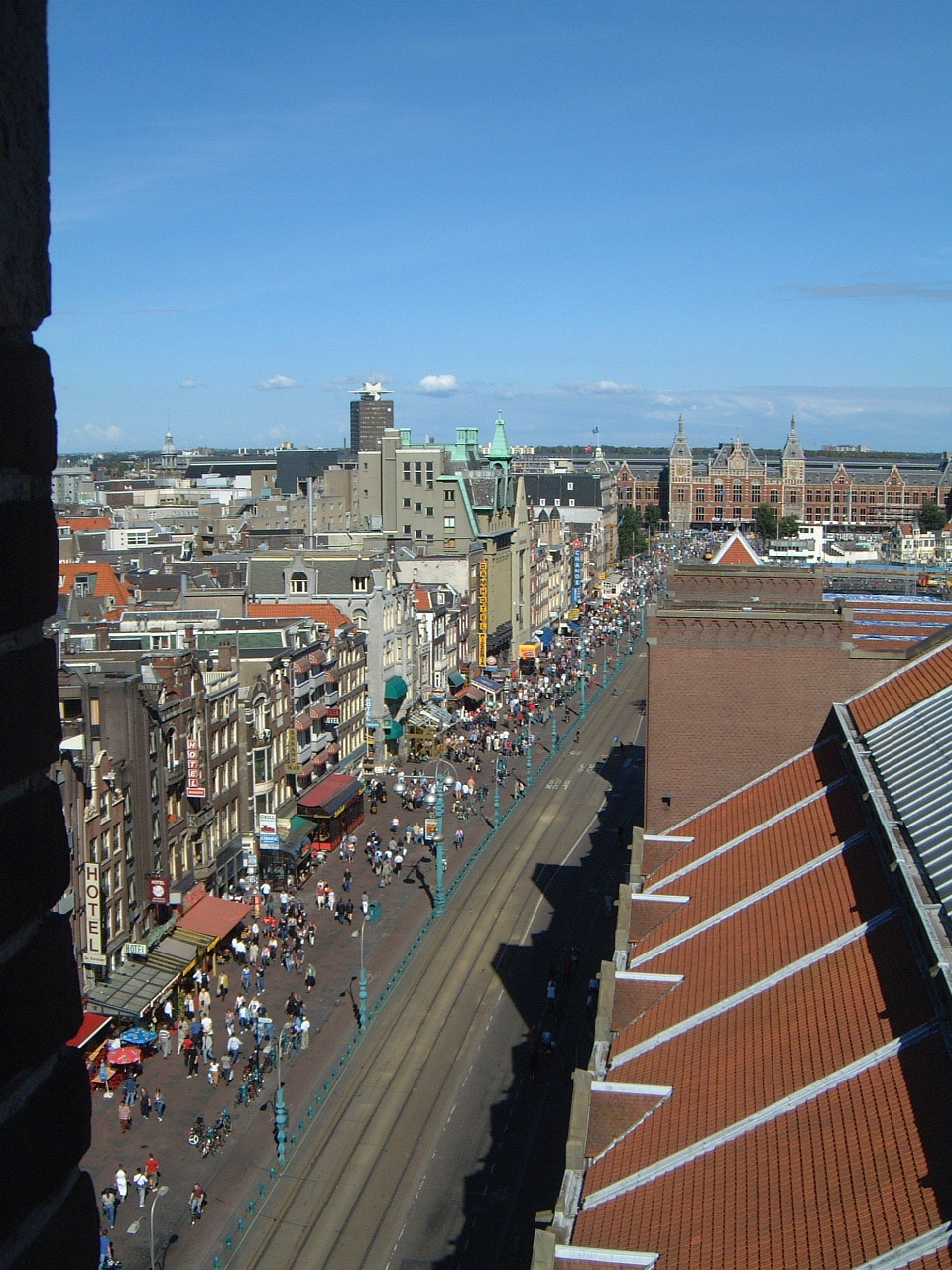 maartent amsterdam cityscape station summer shell city buildings roofs crowd people