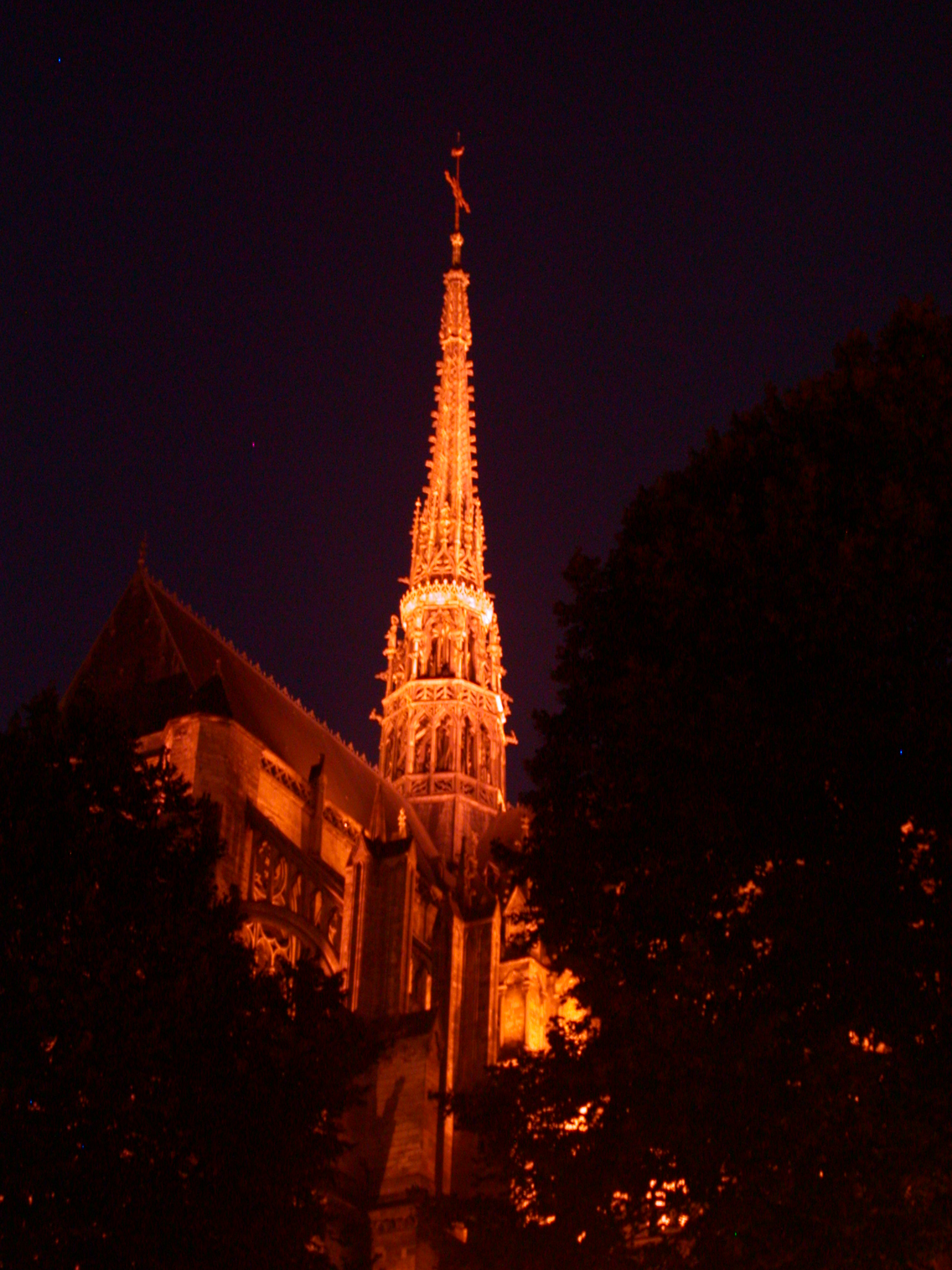 church spire golden higlight light up night dark warm