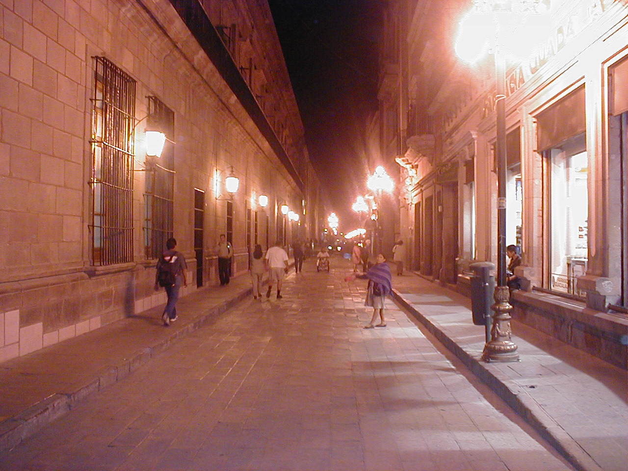 dario night nighttime street lamps lights shops