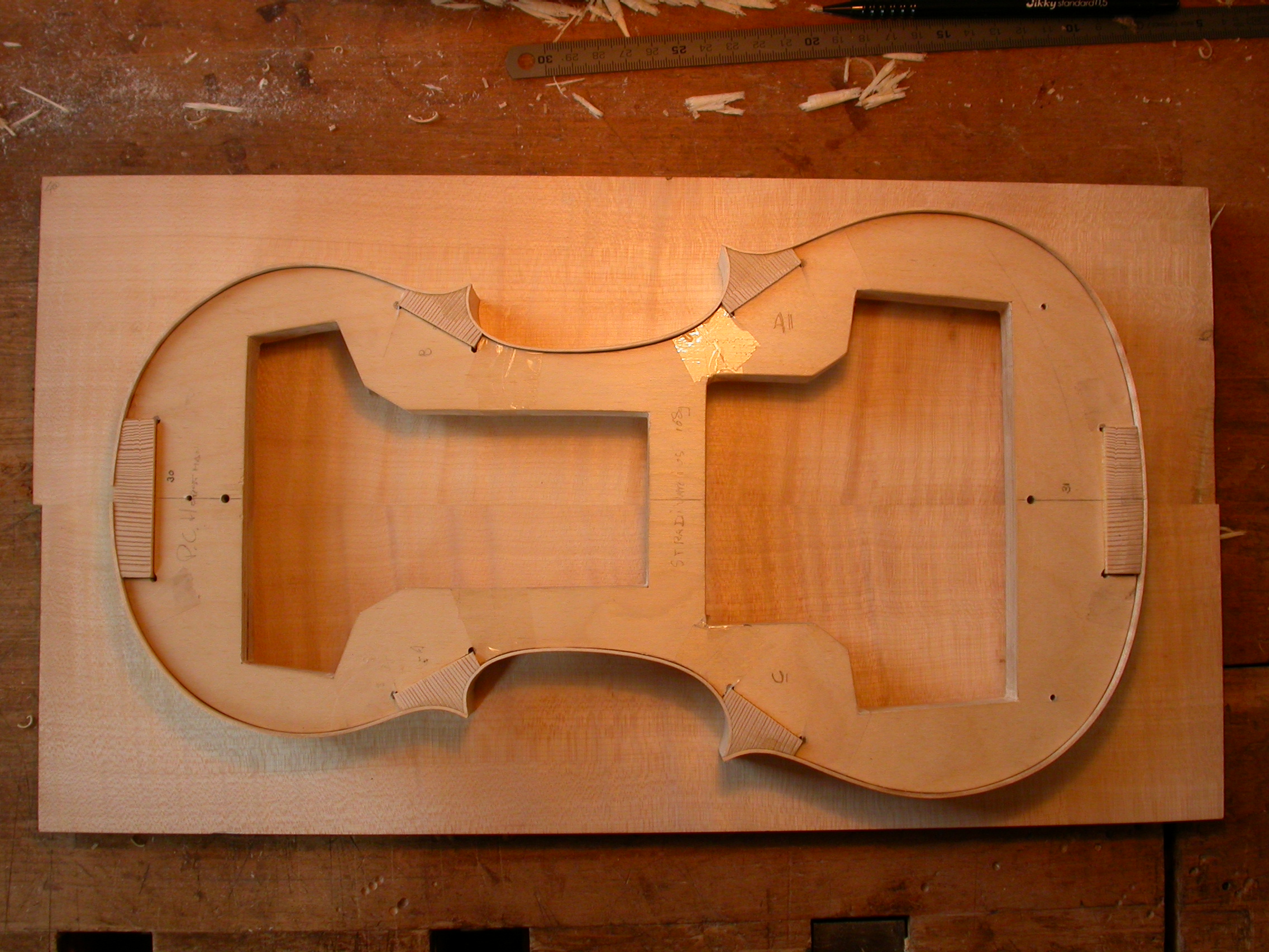 Paul violin wood craft in the making under construction instrument