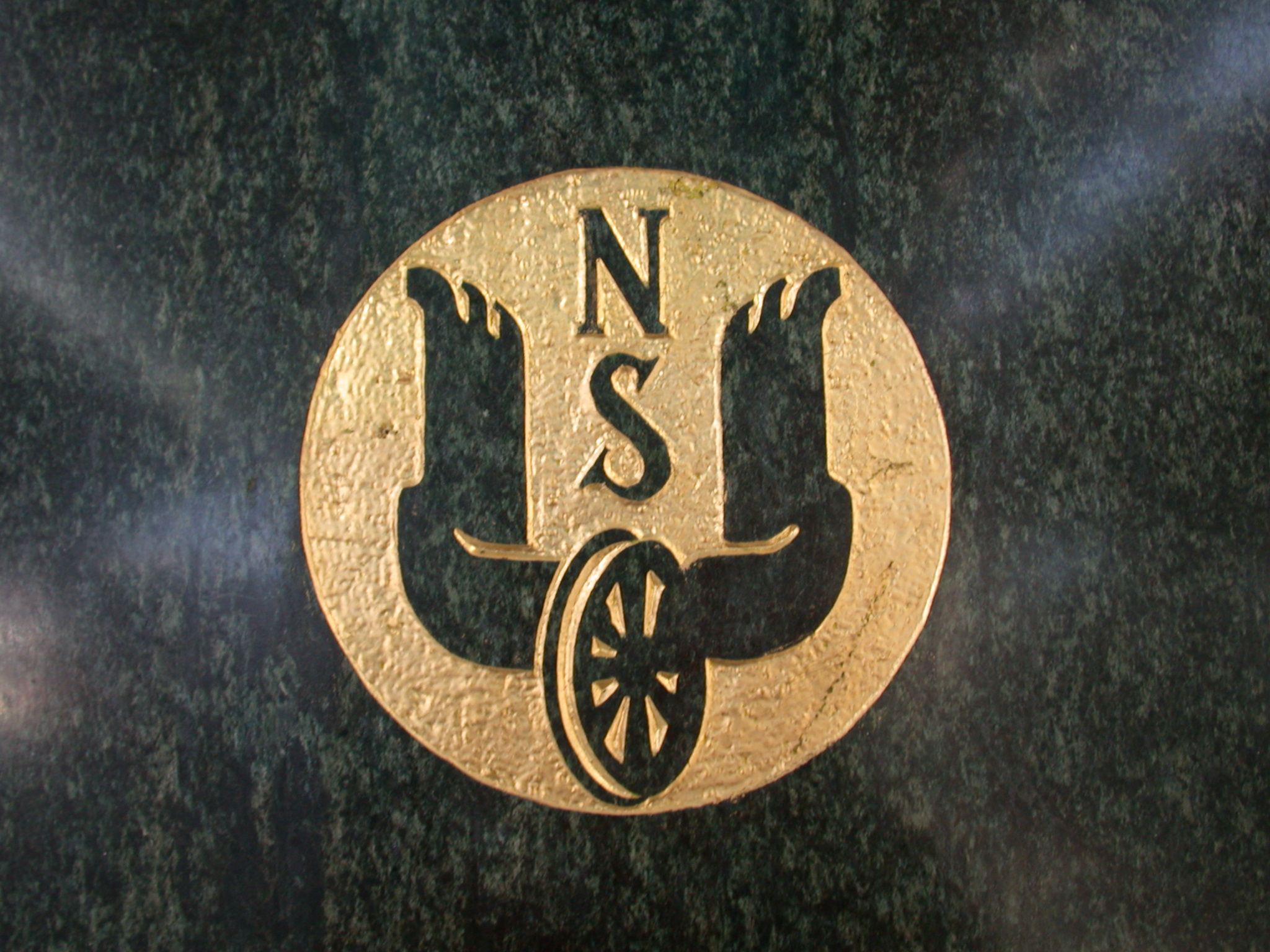 ns logo black gold yellow circle wheel wing wings railways