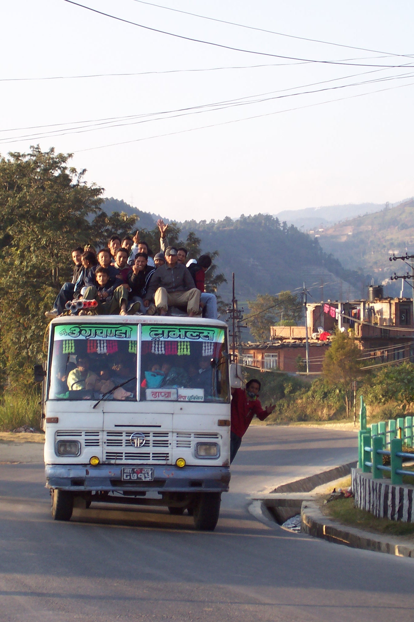 annet bus transport vehicle passengers people sitting on top