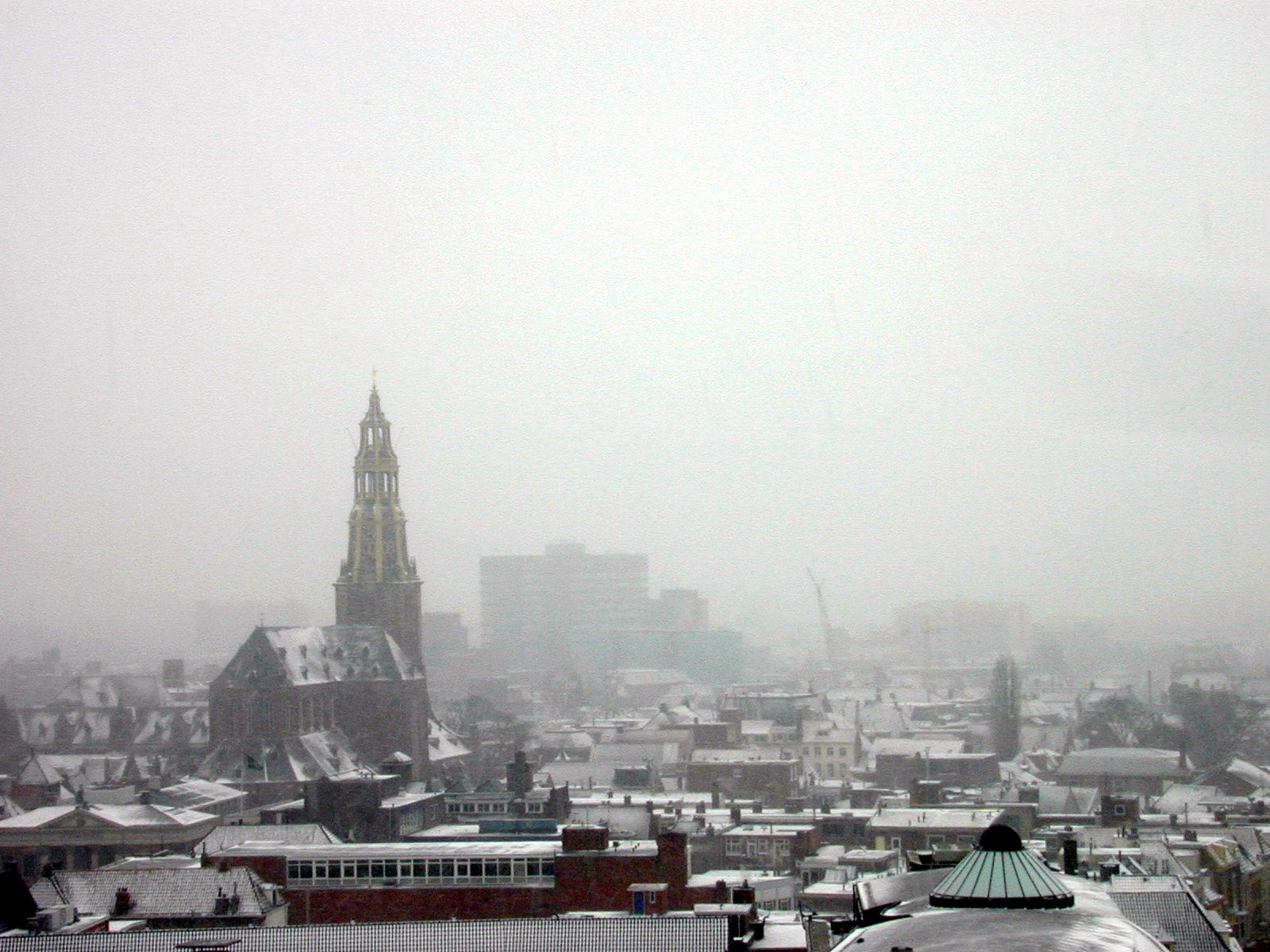 city town rooftop rooftops snow winter church chimney steeple dome