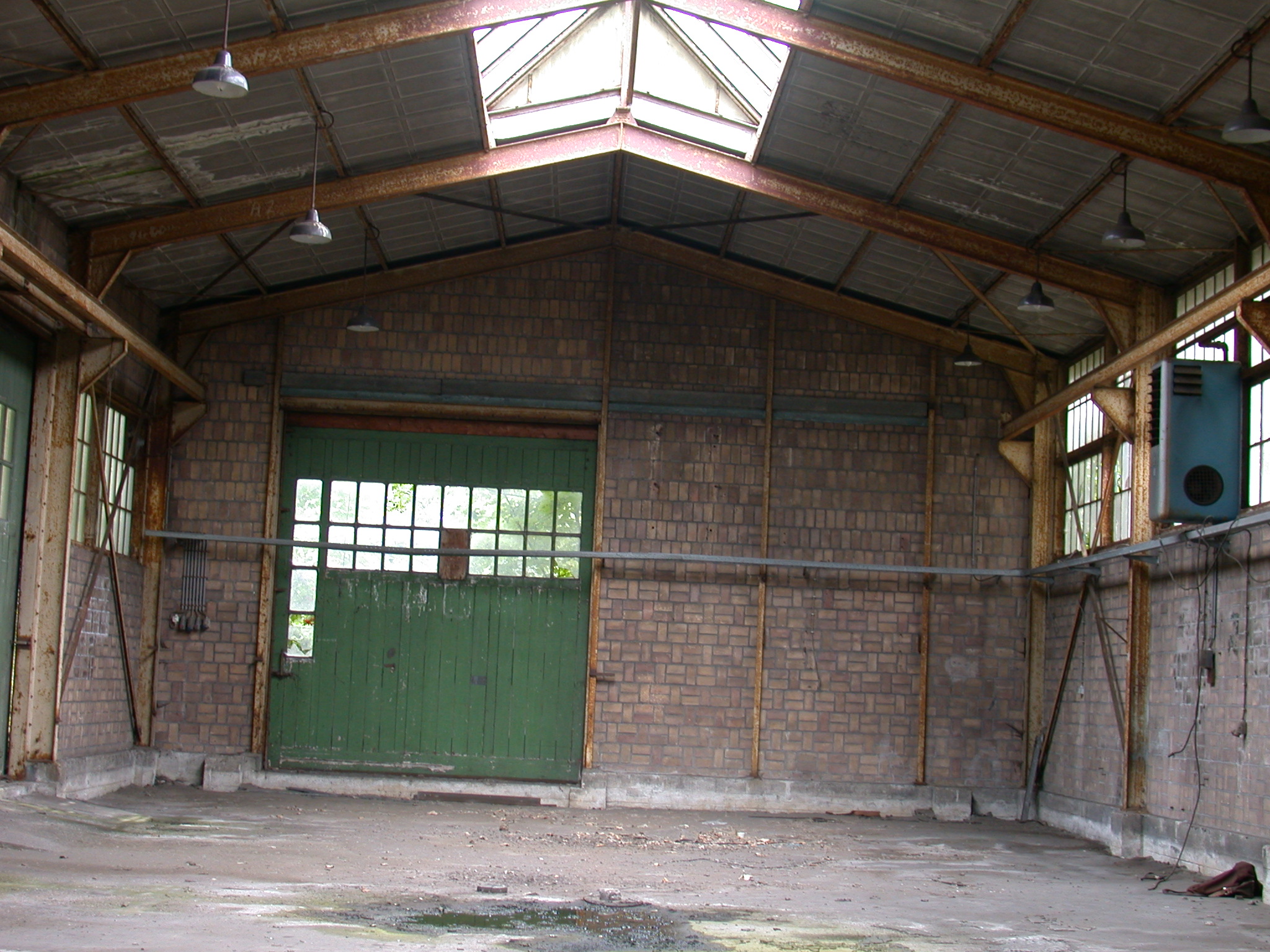 abandoned shed warehouse high windows large green door freight cargo