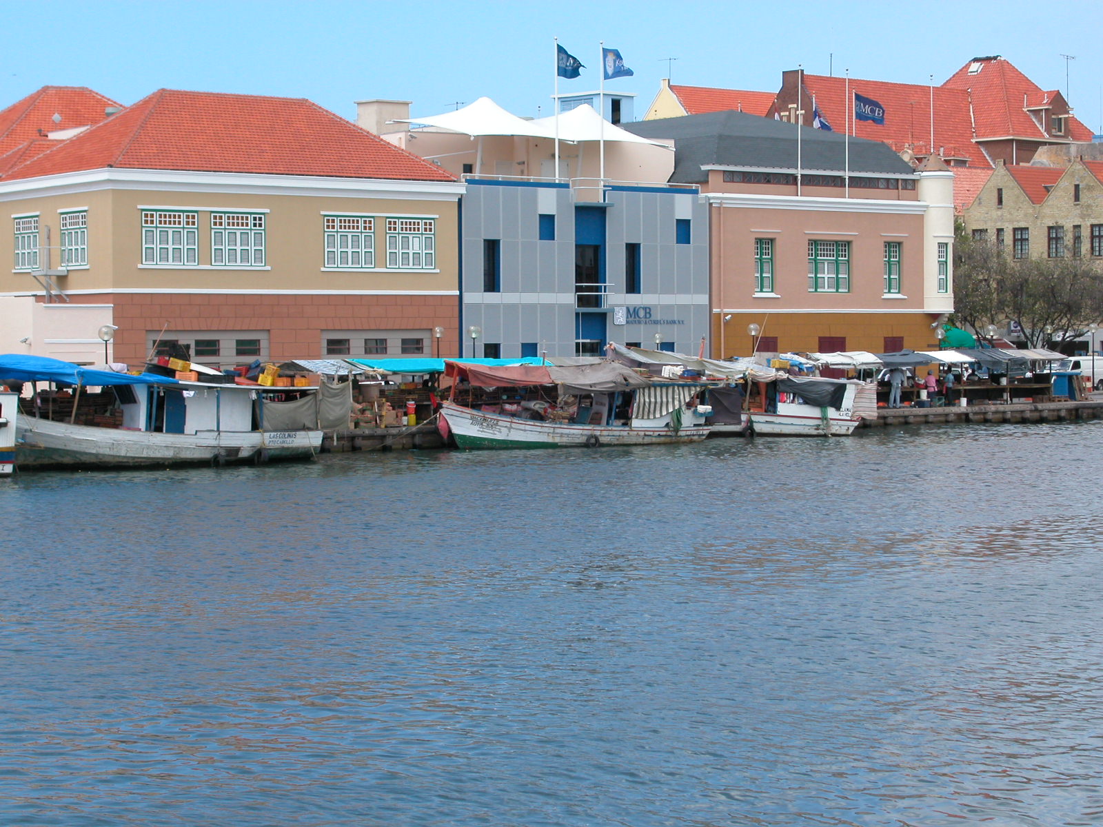 architecture exteriors willemstad curacao jacco water boats quay market river city buildings