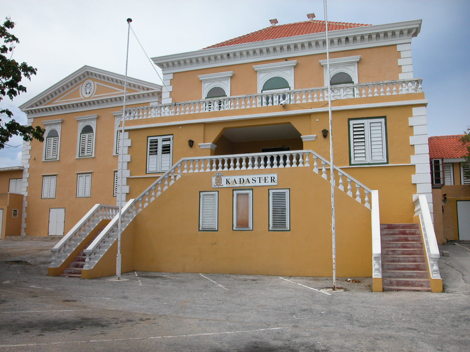 jacco kadaster townhall yellow painted house villa flagpoles balcony