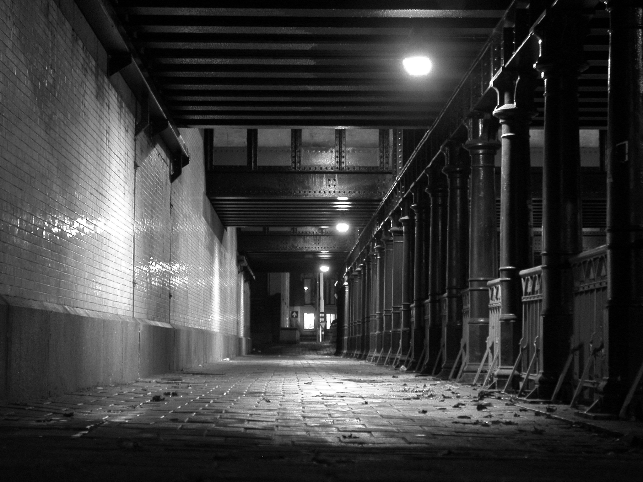 old railway station film noir black and white bridge bricks spooky dark night nighttime