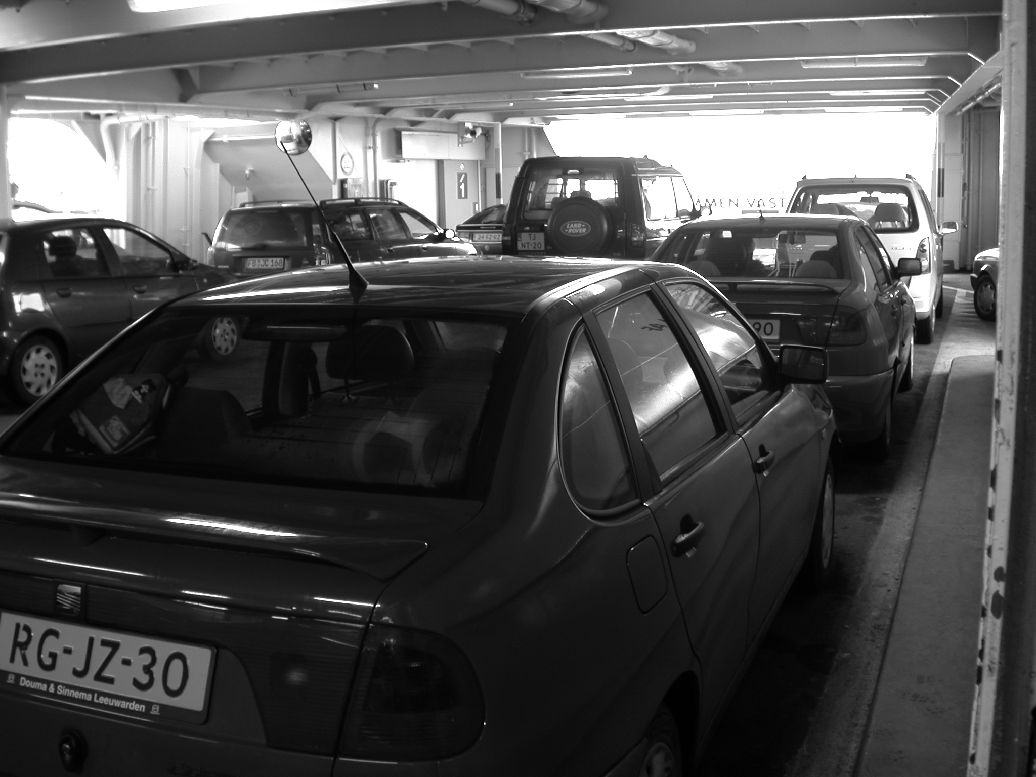 vehicles land car cars ferry b&w parked texel