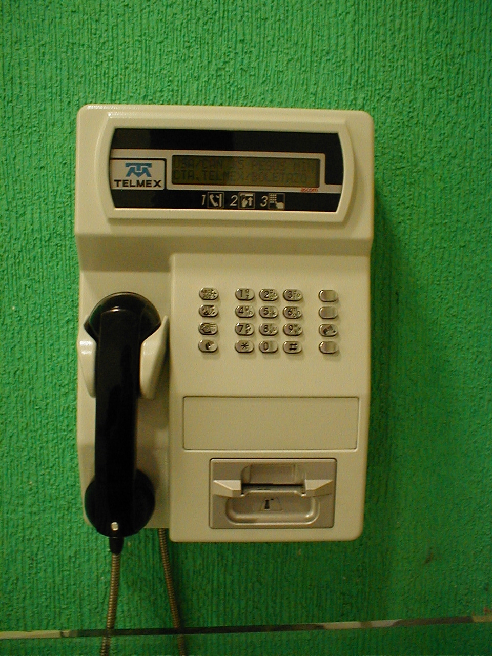 dario telmex telephone green wall calling making a call telephoning communicating