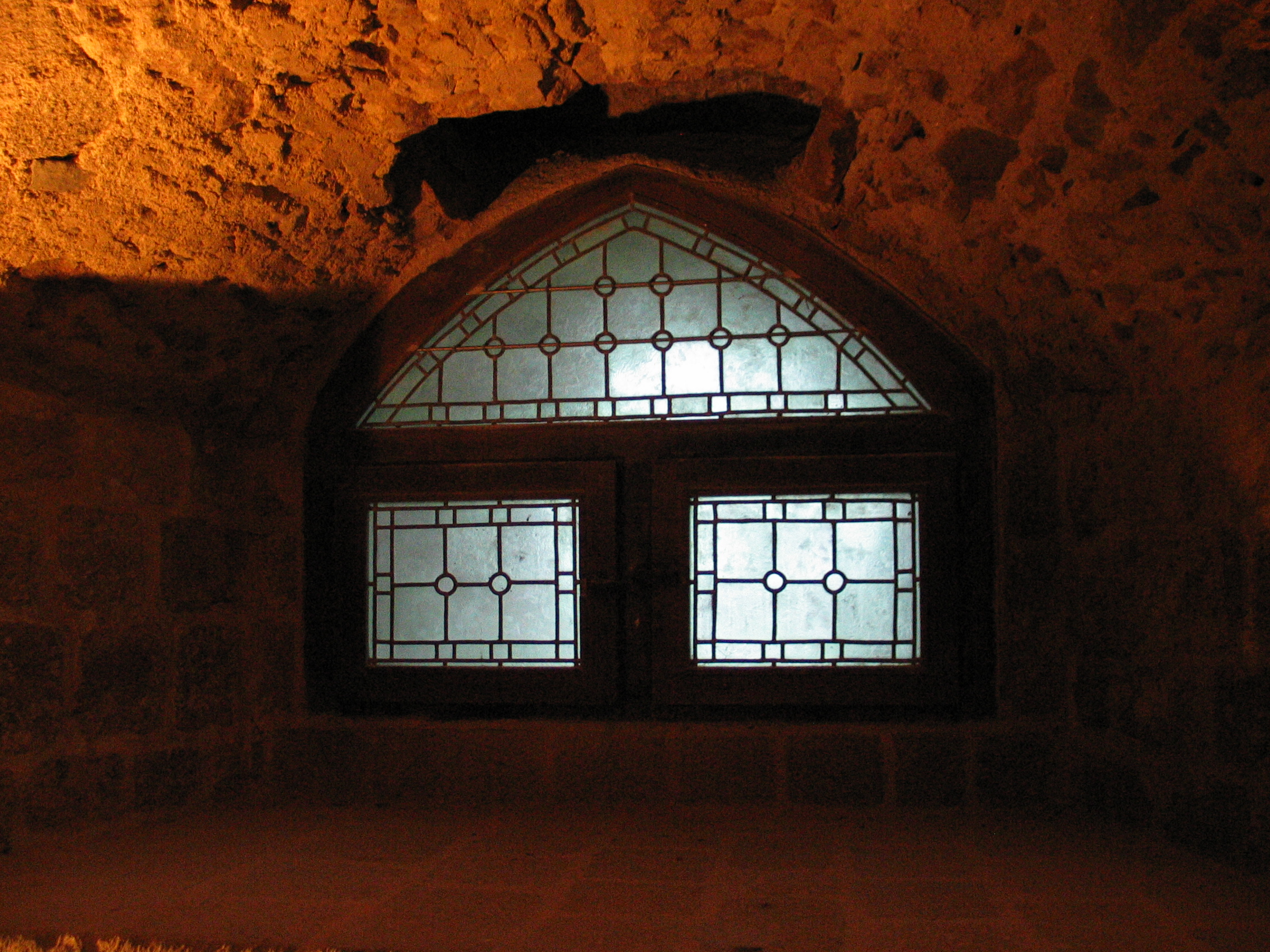 window in a cellar cave rock geoff_vane glass