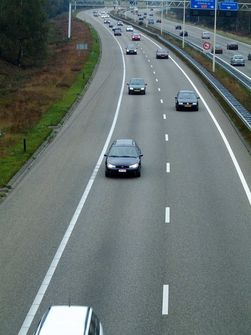 maartent highway freeway autobahn motorway cars driving lane lanes road royalty-free