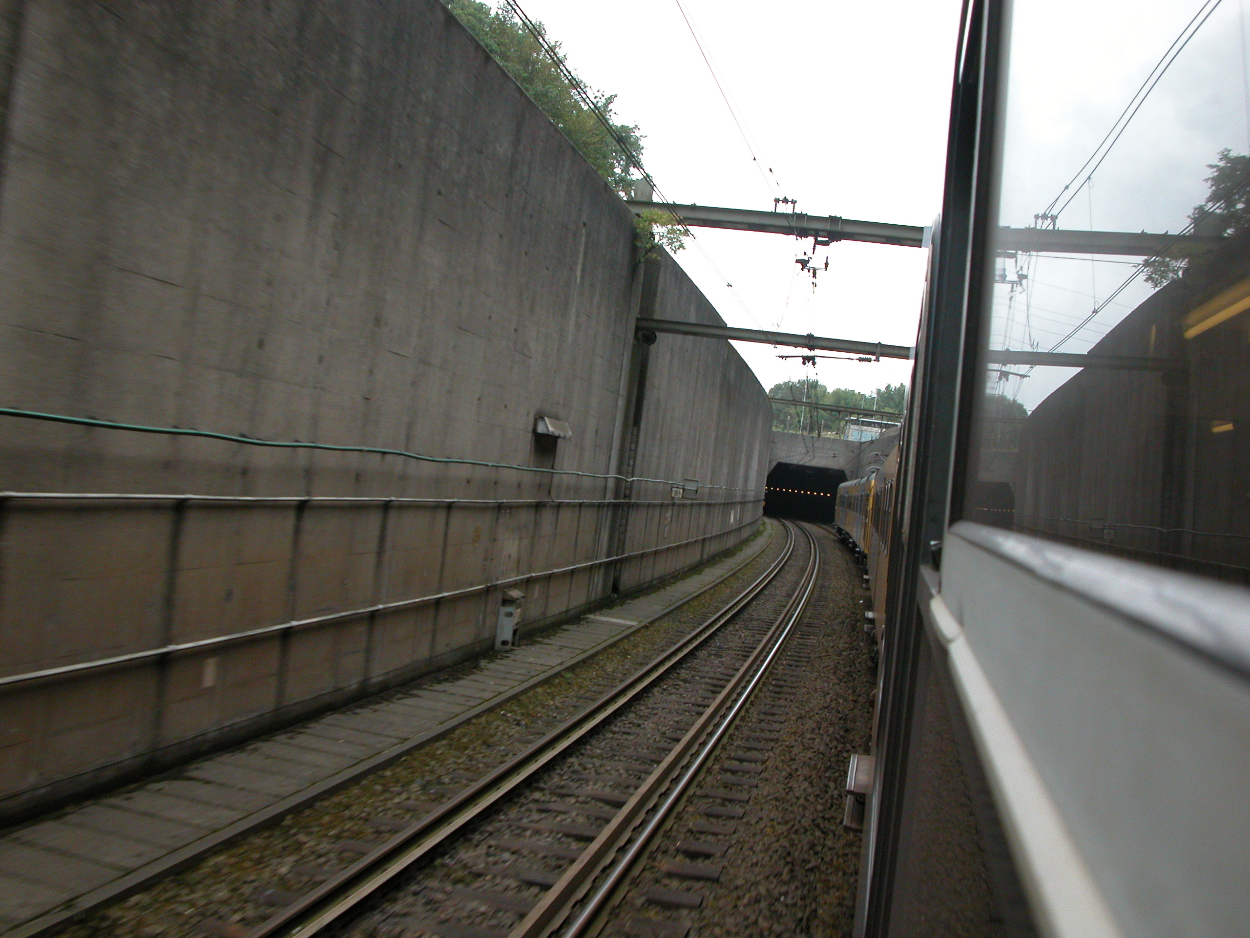 train going down a tunnel rails