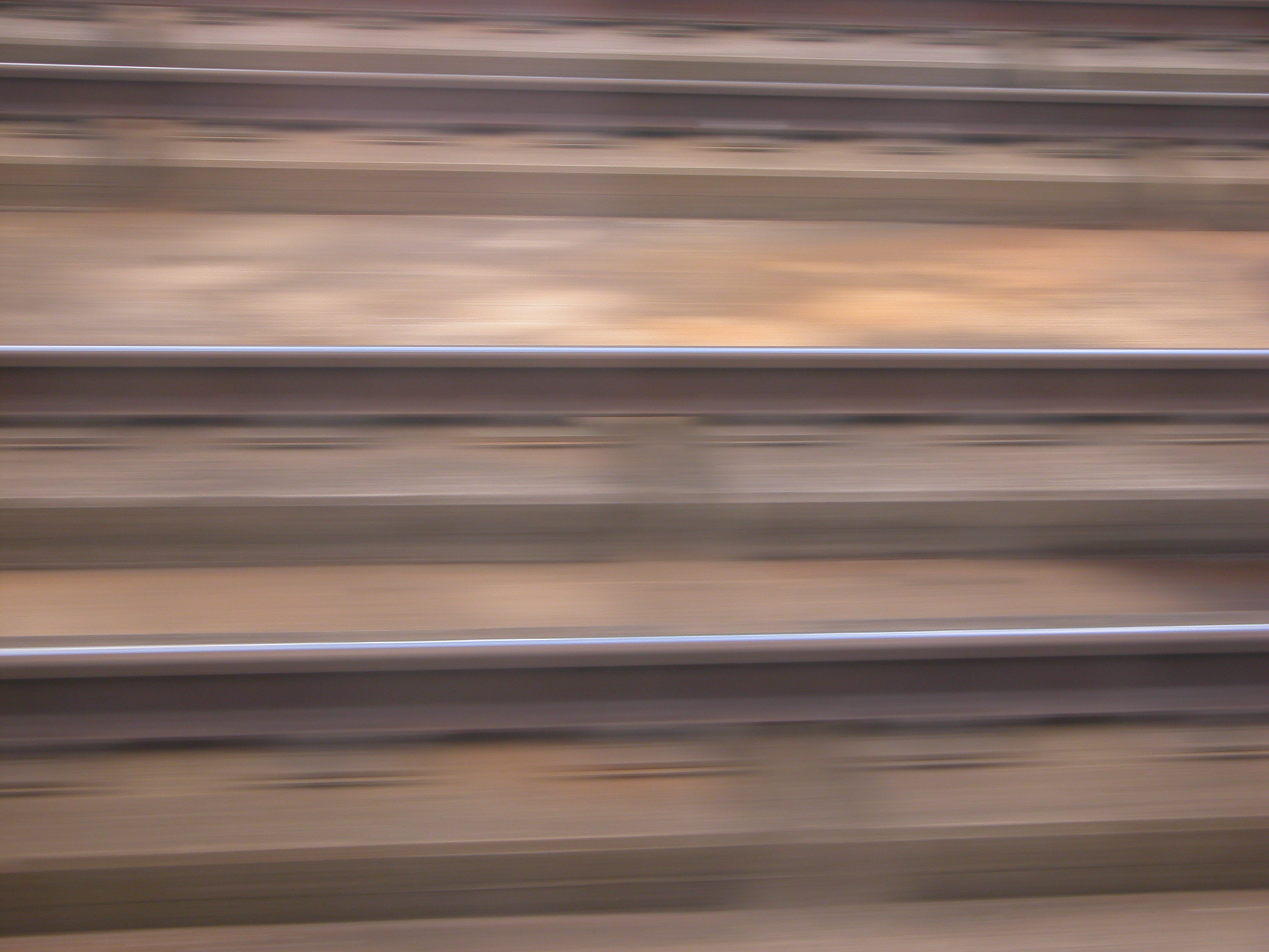 blurs track rail rails speed train brown