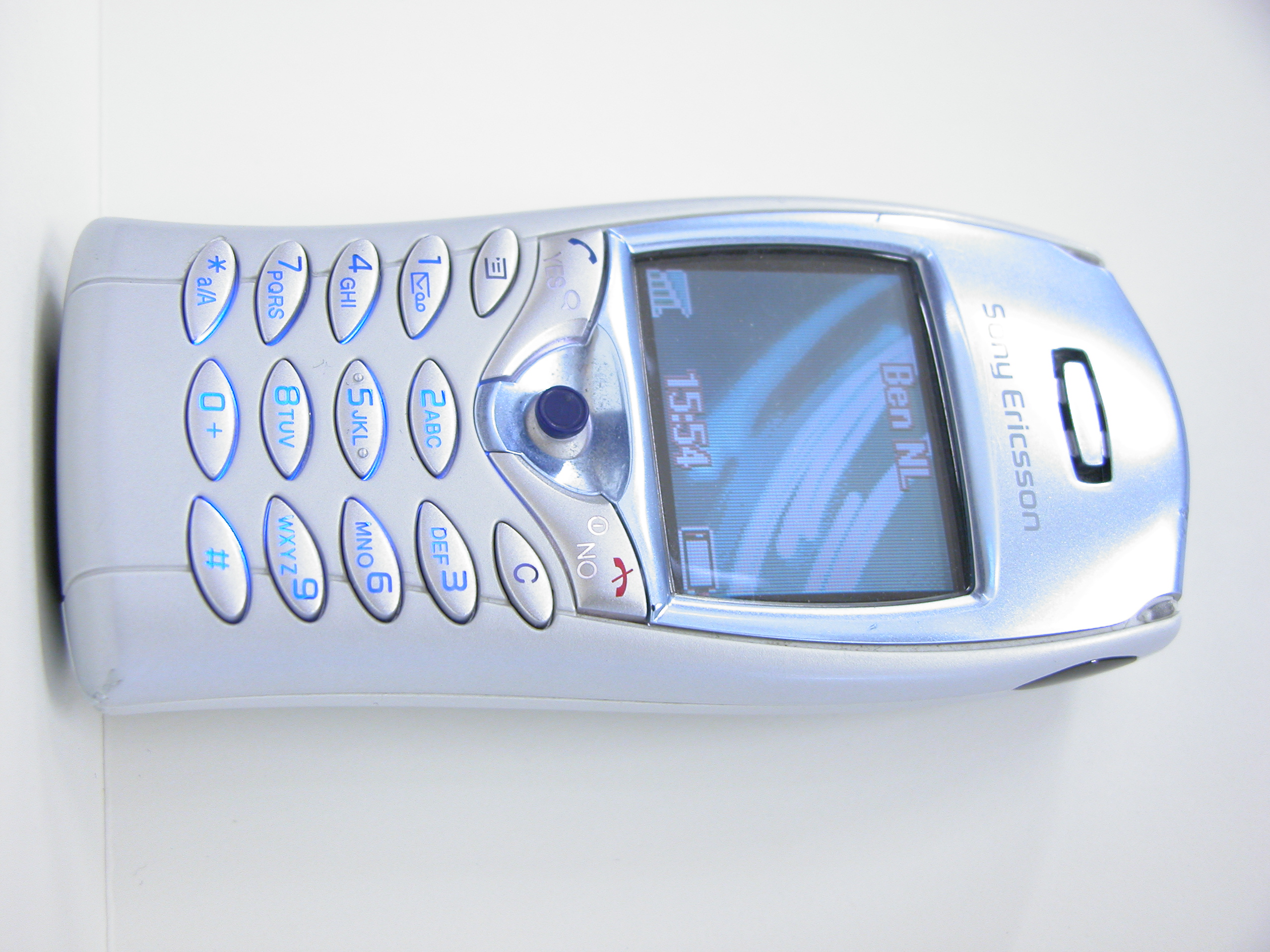 mobile phone white keys display sony ericsson blue shiny texture