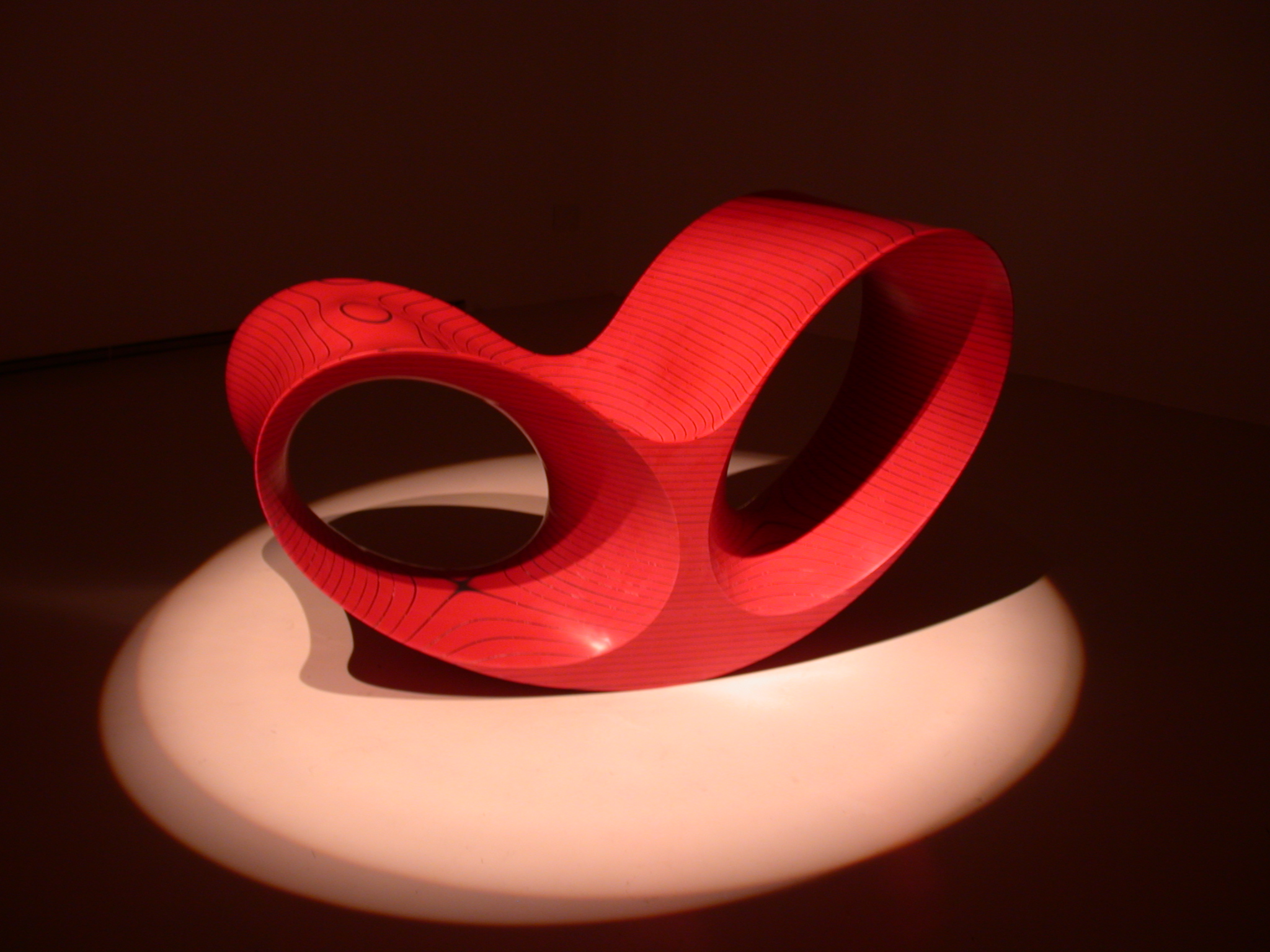 art sculpture red in a beam of light exposition