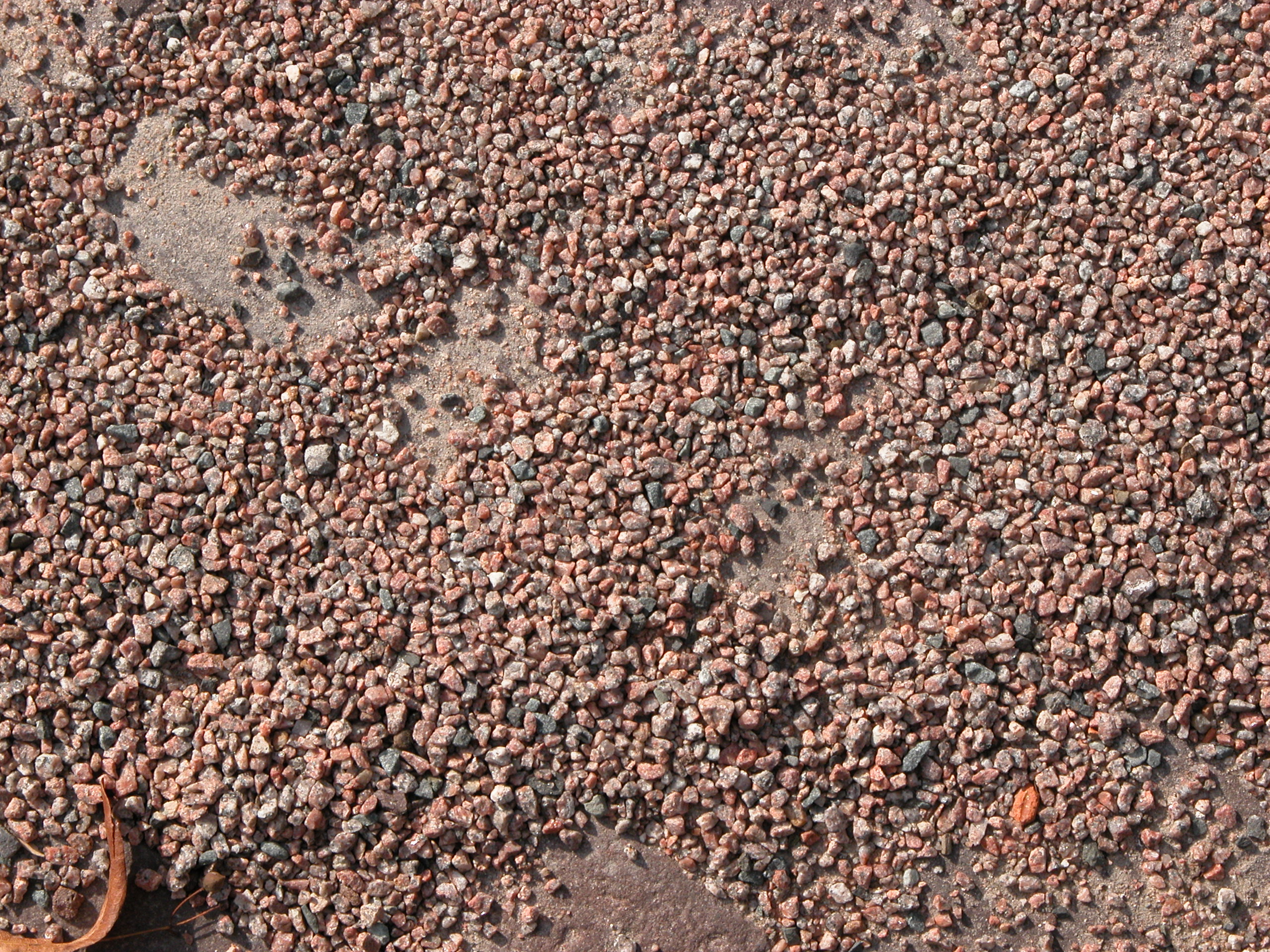 gravel small stones red tennis court