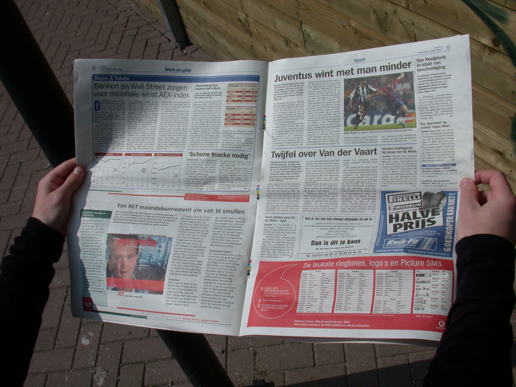 newspaper tabloid format hands holding reading juventus ads advertising