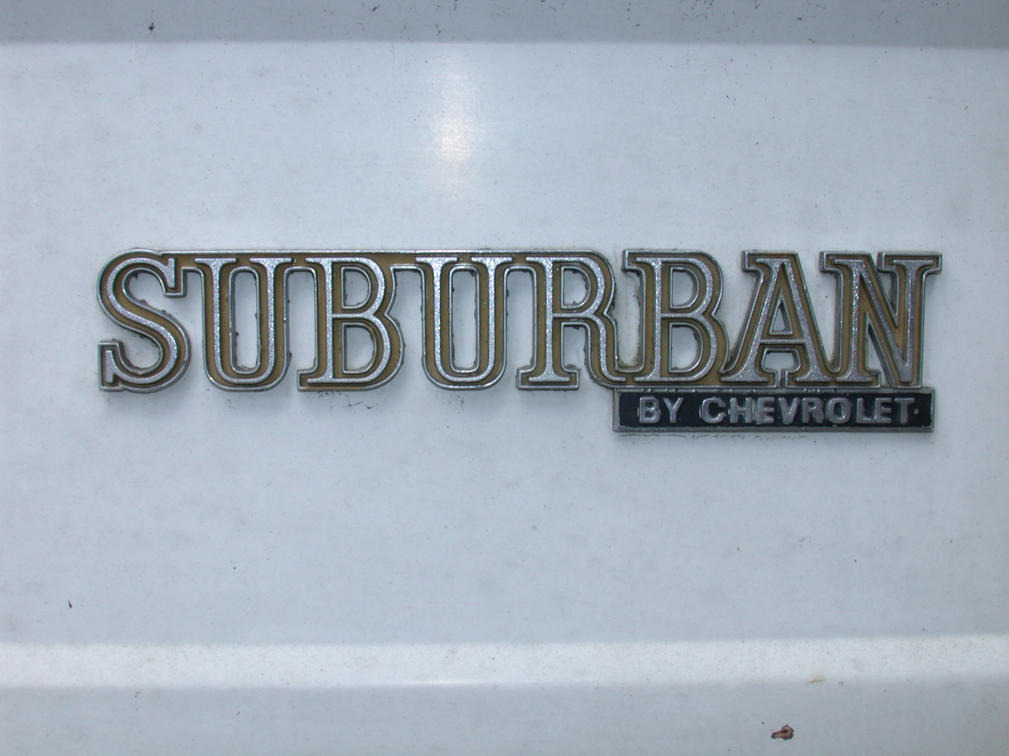 car sign logo plate suburban chevrolet silver shiny white