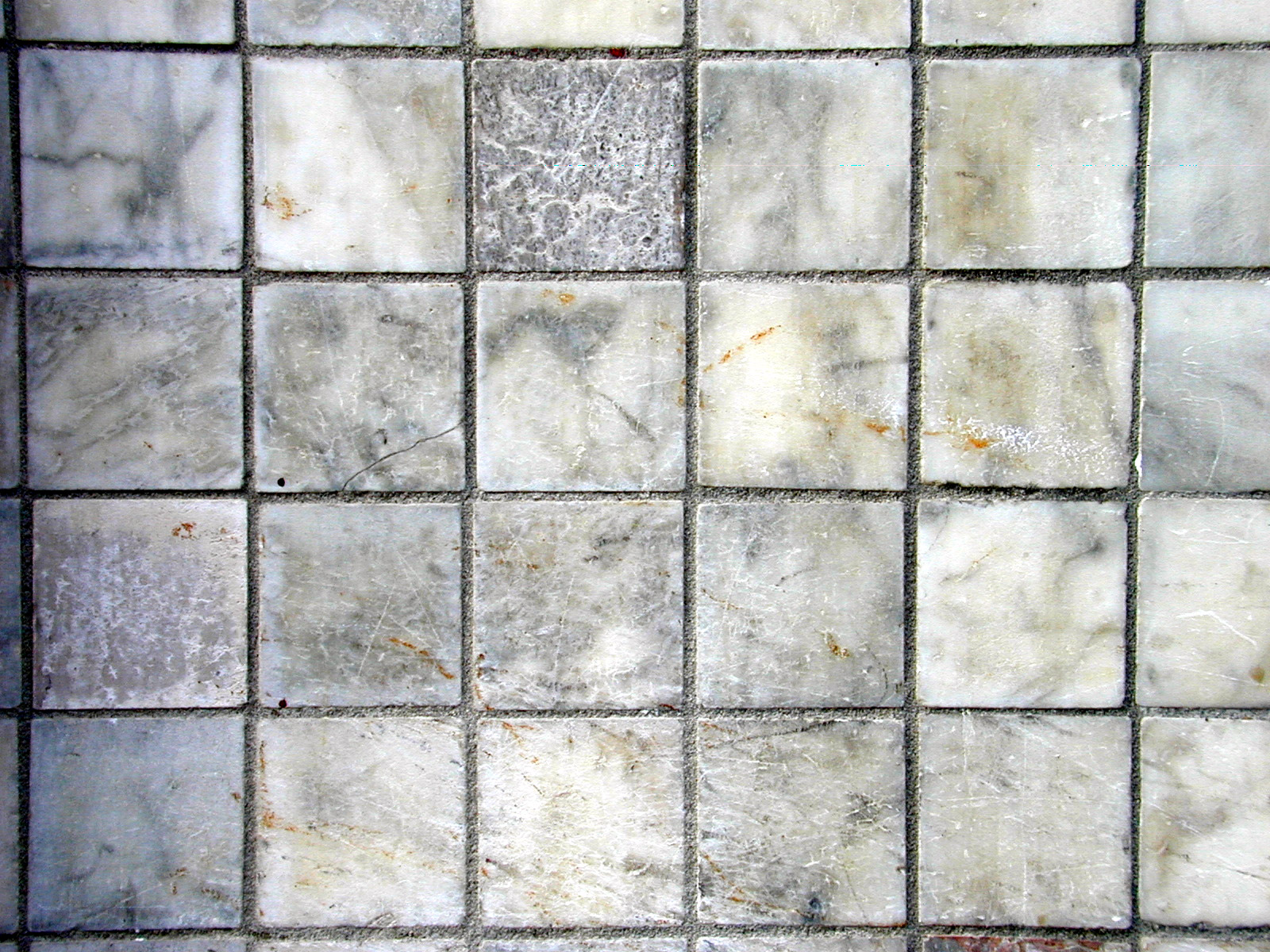 tiles marble set in floor cement cracks