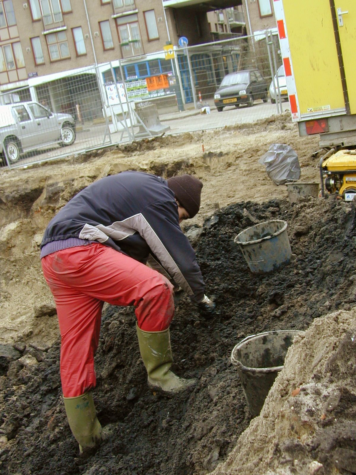 builder boots digging buckets earth workman