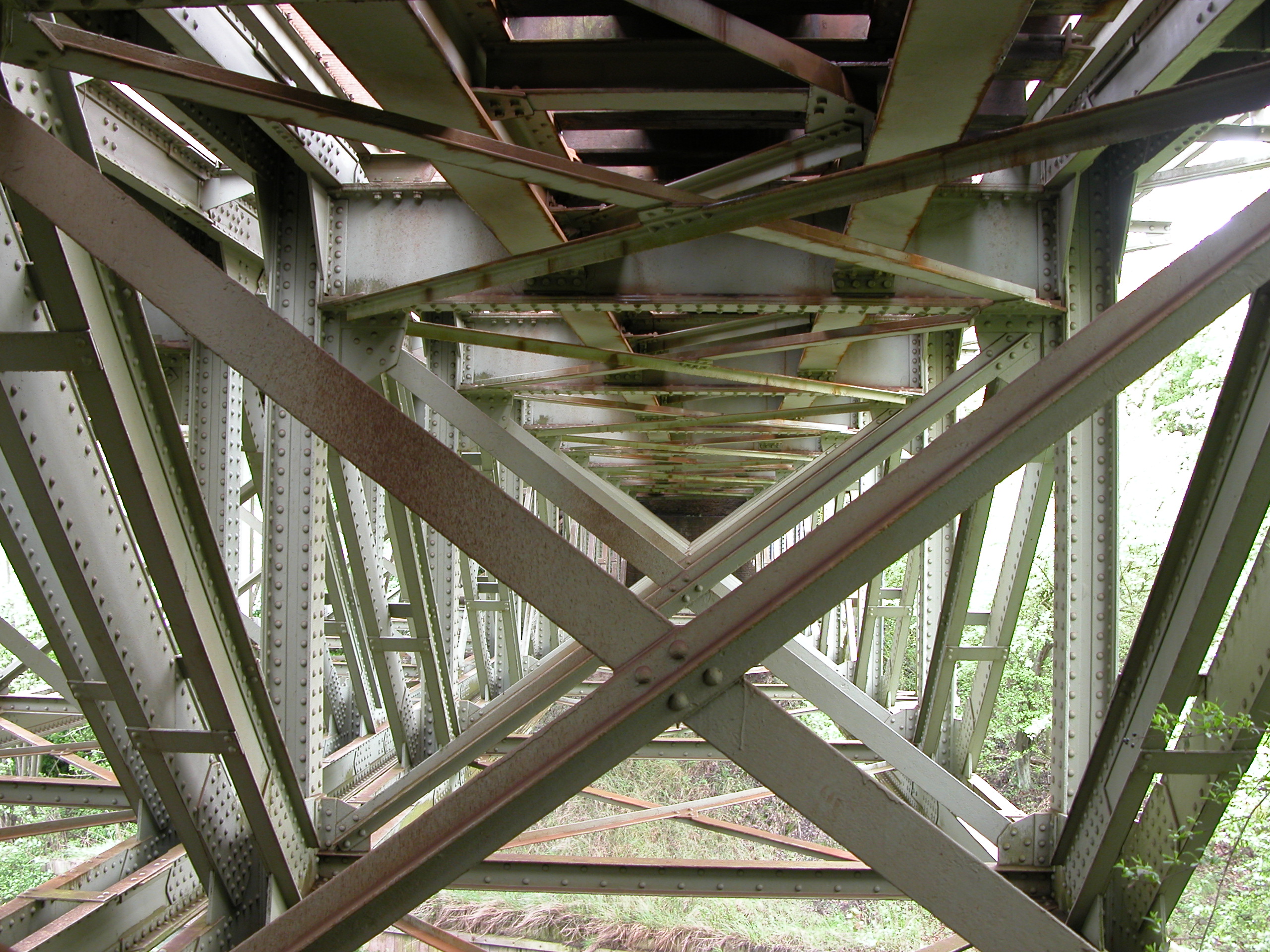 underside of a bridge metal girders beams