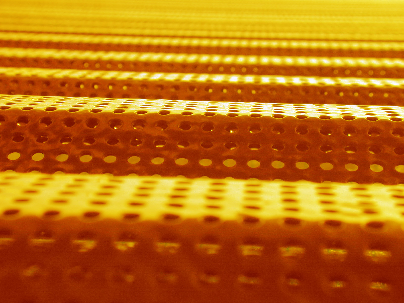 metal surface orange yellow gold golden holes holes