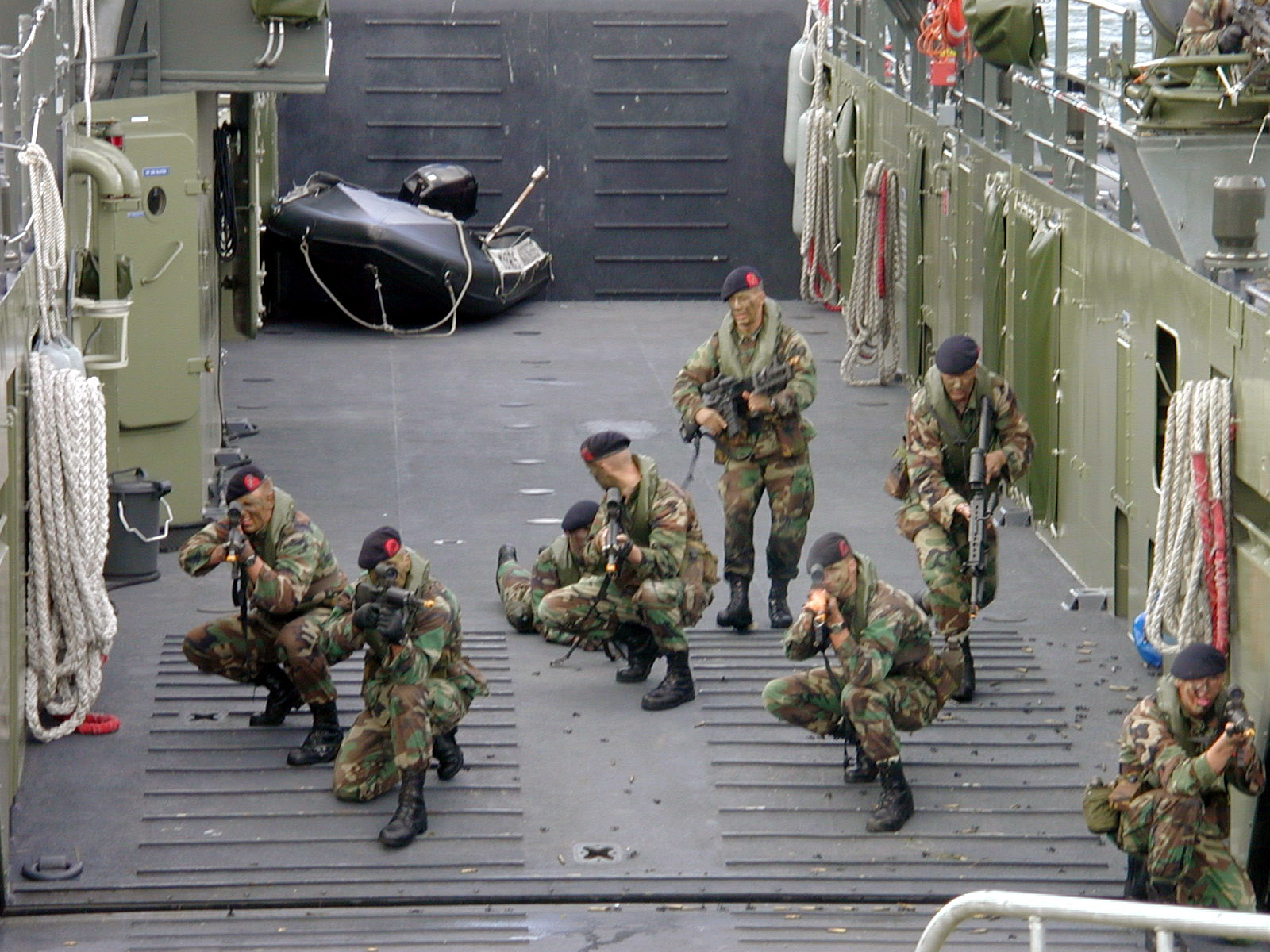 attack gunfire demonstration army millitary navy soldier soldiers gun ak47 boat patrolboat water guns men