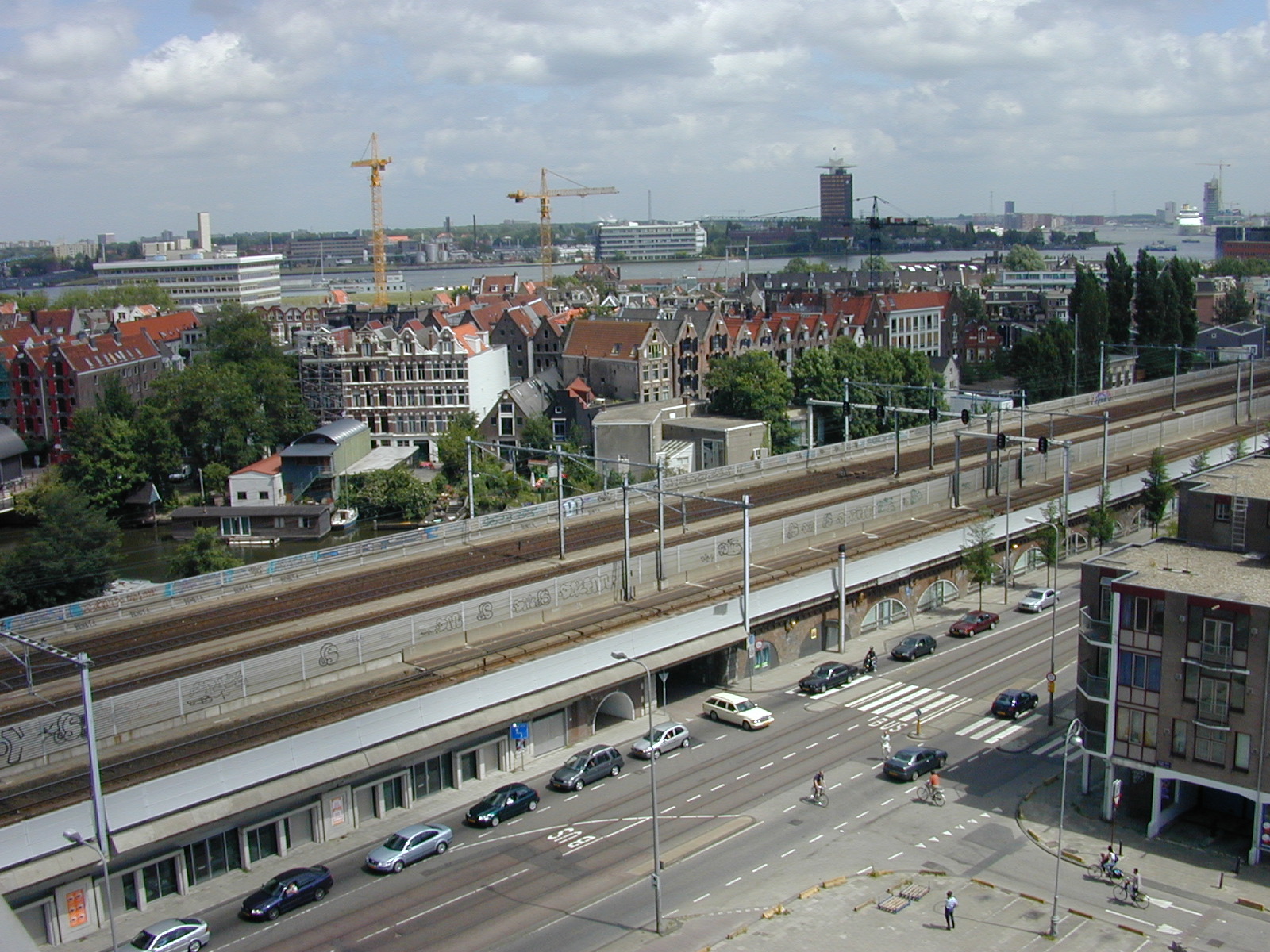 aerial amsterdam cityscape railroad railway houses buildings cranes cars