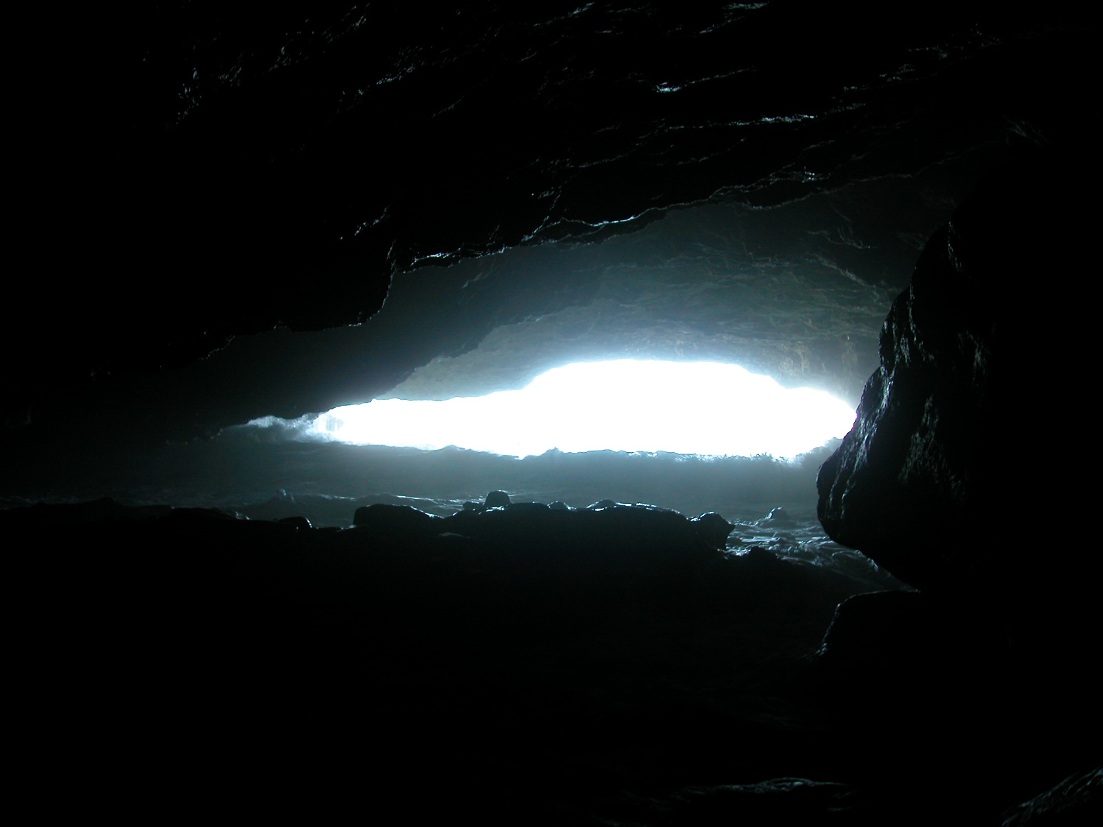 cave mouth entrance of caerbannog rabbit dark bright opening cavern light