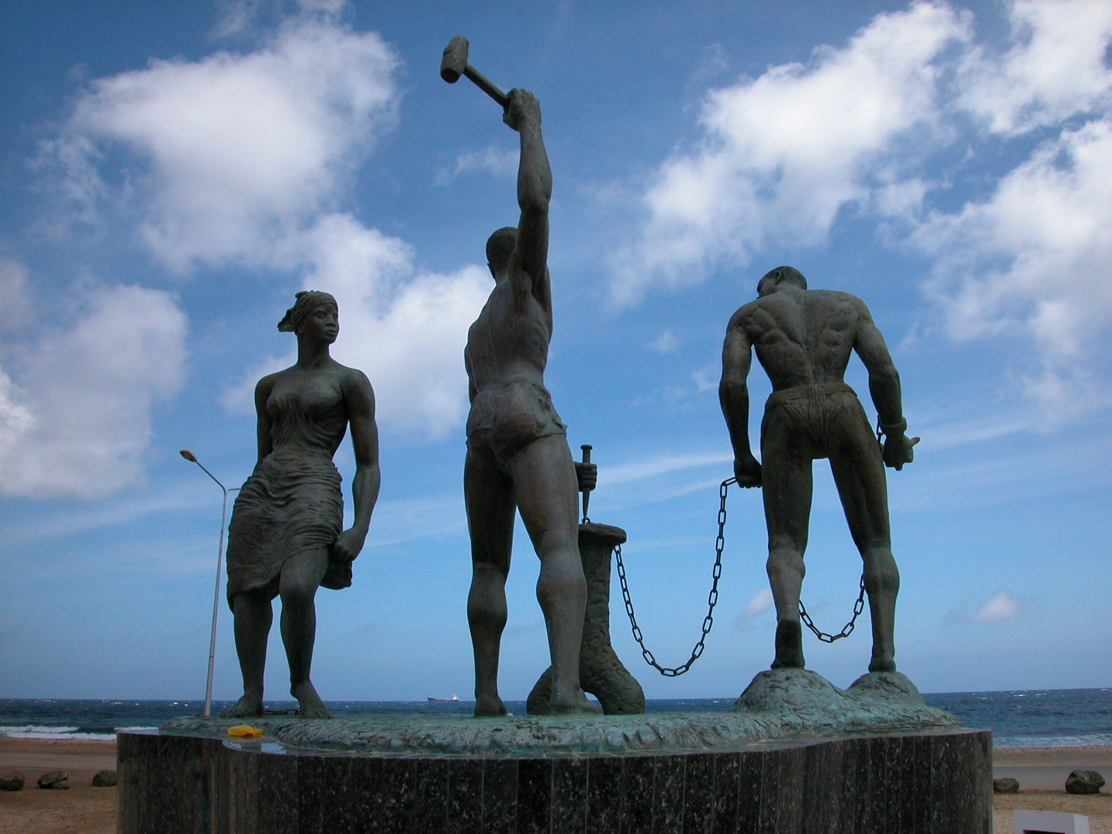statue jacco freedom chains slaves blue sky clouds free images