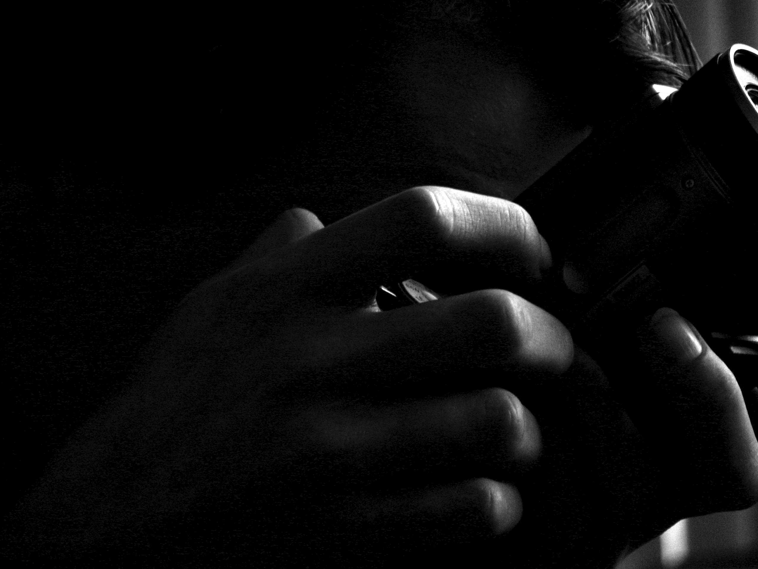 photographer dark camera hands light